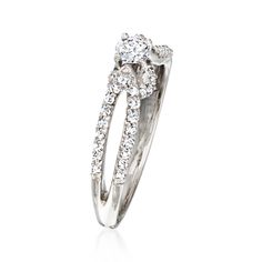 Ross-Simons - C. 1980 Vintage .58ct t. w. Diamond Ring in 14kt White Gold. Size 6.75. C. 1980. Our elegant Estate collection ring features a glistening .18 carat round brilliant-cut diamond centered on a .40 ct. t. w. round brilliant-cut diamond-studded split shank. Finely crafted in polished 14kt white gold, this stylish sparkler would be wonderful as a promise ring or for your upcoming engagement. 3/16" wide. Diamond ring. Exclusive, one-of-a-kind Estate Jewelry. Diamond birthstones are the pe Classic Brilliant Cut Bypass Ring For Anniversary, Classic Bypass Ring With Round Cut Center Stone, Formal Solitaire Bypass Ring In Fine Jewelry Style, Formal Solitaire Bypass Ring Fine Jewelry, Classic Anniversary Bypass Ring With Round Cut, Timeless Bypass Ring With Brilliant Cut For Anniversary, Classic Solitaire Bypass Ring For Anniversary, Timeless Brilliant Cut Bypass Ring For Anniversary, Classic Bypass Ring With Prong Setting