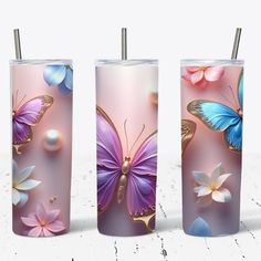 three glass vases with butterflies on them and pearls in the bottom one is pink