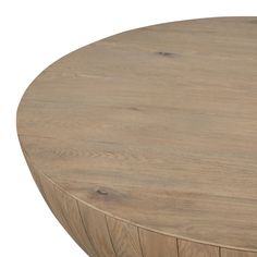 a round wooden table with no one around it