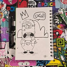 a notebook with a drawing of a cartoon character on it