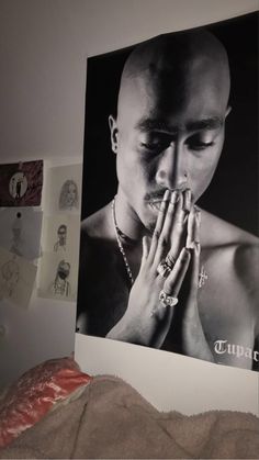 a black and white photo of a man praying