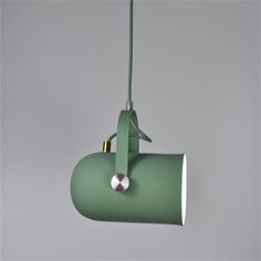 a green lamp hanging from the ceiling