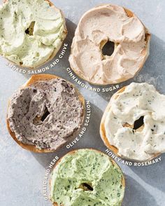 four bagels with different toppings on them