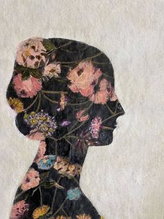 a painting of a woman's profile with flowers on her head and shoulders in black