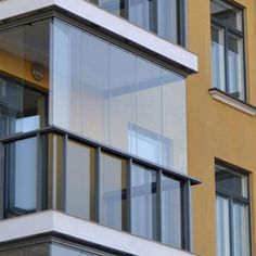 an apartment building with multiple balconies and windows