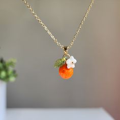 Can't find your perfect fit length? Do have material requirements? We offer custom orange fruit necklace. Your satisfaction is our priority. How to customize? You choose the design; we hand make the necklace for you. Elevate your style with this exquisite orange flower pendant necklace. The pendant is delicately crafted with intricate details, capturing the beauty of nature in its design. You offer various colors of orange. Lightweight and comfortable to wear, it's the perfect accessory to compl Coworker Appreciation, Rain Design, Fruit Necklace, Anniversary Necklace, Orange Necklace, Fruit Jewelry, Orange Fruit, Flower Pendant Necklace, Jewelry Lookbook