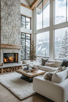 a living room filled with furniture and a fire place in front of a large window