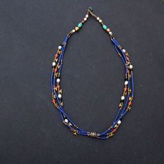 3 strands of Lapis lazuli , corals turquoise and brass beads necklace Approximately 19 inches long Blue Double Strand Spiritual Necklace, Blue Double Strand Bohemian Turquoise Necklace, Bohemian Double Strand Turquoise Necklace, Bohemian Blue Double Strand Turquoise Necklace, Blue Multi-strand Natural Stone Necklaces, Blue Multi-strand Natural Stone Necklace, Artisan Multi-strand Blue Necklaces, Blue Multi-strand Necklace With Natural Stones, Blue Double Strand Jewelry With Tiny Beads