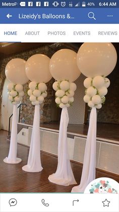 balloons and flowers are on display in front of a mirror