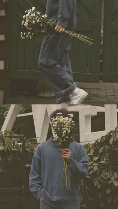 a person jumping in the air with flowers on their head and another man standing next to him