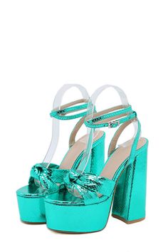 Metallic material Bow detailing Adjustable ankle strap with buckle closure Platform sole Open square toe High block heel Green Ankle Strap Heels With Buckle Closure, Trendy Green Heels With Buckle Closure, Turquoise Ankle Strap Heels For Party, Green Block Heels With Buckle Closure, Green Block Heel Heels With Buckle Closure, Green Block Heel Shoes With Buckle Closure, Turquoise Heels For Party, Platform Heels Boots, Thigh High Boots Heels