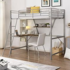 a loft bed with desk underneath it in a living room next to a white wall