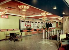 the interior of a diner with tables and chairs