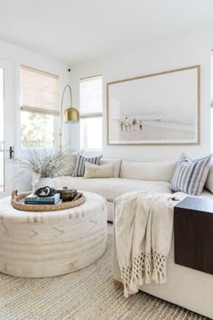 a living room filled with furniture and pillows