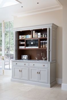 a kitchen with cabinets and appliances in it