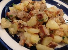 a blue and white plate topped with food