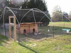 a dog house in the middle of a field