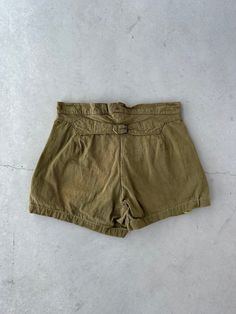 29" waist (can adjust smaller) 3.5" inseem 12" rise 42" hips Cotton canvas material Rusted Metal buttons that read "For Gentlemen" 2/5 fly buttons replaced Cinch back buckle strap Sewn into shorts from trouser pants Olive green drab color Rust marks by fly Military Style Summer Shorts With Belt Loops, Military Style Shorts With Belt Loops For Summer, Military Style High-waist Bottoms With Belt Loops, Vintage Cotton Khaki Shorts, Vintage Belt Loop Shorts For Summer, Vintage Summer Shorts With Belt Loops, Vintage Shorts With Button Closure, Vintage Short Bottoms With Belt Loops, Vintage Shorts With Belt Loops