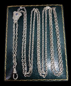 Here we have an incredible antique long guard / muff chain dating from circa 1920s originating from mainland Europe most likely France featuring high quality sapphire paste slider.  Length approx - 55"  Message me any questions  ITEM - S1559 Antique Oval Link Chain Necklace, Antique Engraved Chain Link Jewelry, Antique Necklaces With Rectangular Link Chain, Antique Curb Chain Necklace, Luxury Antique Nickel-free Necklaces, Silver Tarnish-resistant Chain Necklace With Rectangular Links, Artisan Antique Silver Nickel-free Necklace, Antique Art Deco, Sliders