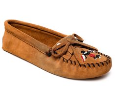 Meaningfully redesigned by Minneapolis-based Native American designer Lucie Skjefte, this beautiful suede moccasin features vibrant beading, classic stitch detailing, and a fit that keeps feet wrapped in comfort. From Minnetonka. Brown Slip-on Moccasins With Moc Toe, Brown Leather Non-slip Moccasins, Traditional Brown Hand-stitched Moccasins, Artisan Brown Slip-on Moccasins, Brown Slip-on Moc Toe Moccasins, Native American Moccasins, Suede Moccasins, American Design, Moccasins