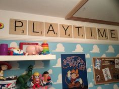 there are many toys on the shelves in this play time room with scrabble tiles