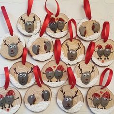 christmas ornaments made to look like reindeers with red bows