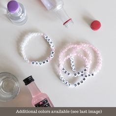 some beads and bottles on a table with the words drink, don't drink