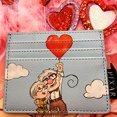 Super Cute Loungefly Disney Up Valentine's Card Holder. It Has Slots For Credit Cards And A Pocket For Coins And Bills. Disney Card Holder, Valentines Card Holder, Claw Game, Loungefly Hello Kitty, King Card, Disney Cats, Disney Cards, Disney Up, Hello Kitty Characters