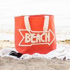 You'll be beach ready with the Aruba Water Resistant Tote! Water resistant so your belongings won't get wet, this tote bag features a vibrant coral color with the word 'Beach' hand embroidered across the front and inner pockets inside for extra organization, this water resistant bag will be your new summertime staple. This beach bag effortlessly doubles as a cruise bag, sports bag, or overnight bag to store your travel essentials. The perfect vacation bag or "weekend vibes'' bag! This reusable t Vacation Bag, Beach Tote Bag, Beach Ready, Beach Accessories, Weekend Vibes, Beach Tote Bags, Beach Tote, Overnight Bag, Coral Color