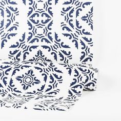 the blue and white paper is folded up to look like an intricate design on it