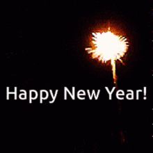 a street light with the words happy new year written on it in front of a dark background