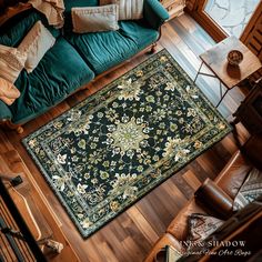 an overhead view of a living room with a green couch and rug on the floor