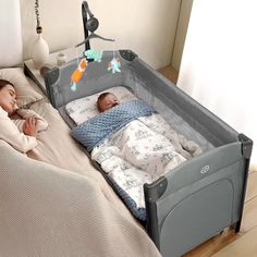 two babies are sleeping in their cribs on the floor next to each other