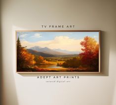 a painting hanging up on the wall above a chair in front of a tv frame