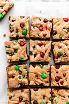 chocolate chip cookie bars with m & m candies on top and one cut in squares