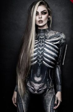 a woman with long hair and skeleton makeup is posing for a magazine advertise