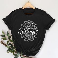 This stylish unisex, 'Namaste' t-shirt fits like a well-loved favorite. Super soft cotton and excellent quality print make one fall in love with it over and over again. It feels soft and lightweight, with the right amount of stretch. It's comfortable and flattering for both men and women. This t-shirt is a perfect gift for anyone who loves spirituality, yoga, and meditation. This namaste mandala OM t-shirt is made out of 100% soft spun cotton. Get yours today! Spiritual T Shirts, Yoga Tshirt Design, Spiritual Outfits, Chakra Wall Art, Positive Shirts, Spiritual Home Decor, Spiritual Clothing, Spiritual Home, Spiritual Shirts