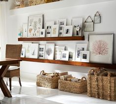 the shelves are filled with pictures and wicker baskets