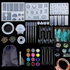 an assortment of crafting supplies and tools displayed on a black background