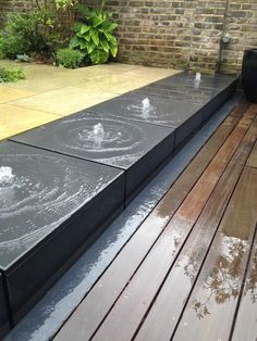 a wooden deck with water running down it