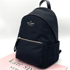 Brand New With Tag Kate Spade Chelsea Medium Backpack Black Color: Black 13.7"H X 10.4"W X 7.2"D Nylon Smooth Pvc Trim Metal Pinmount Logo Two Way Spade Jacquard Lining Interior: Front Slip, Front Credit Card Slots, Key Leash, & Back Zip Pockets Exterior: Front Zip Pocket & 2 Side Pockets Zip Around Closure Dust Bag Not Included Imported Kate Spade Luxury Standard Backpack, Minnie Mouse Backpack, Kate Spade Backpack, Packable Backpack, Pvc Trim, City Backpack, Flap Backpack, Quilted Backpack, Medium Backpack