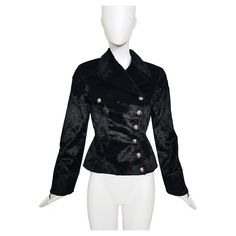 Made of soft black faux fur fabric, this biker jacker has the emblematic sculpted Mugler’s shape. -Double breasted biker cut -Closed by six silver snap buttons embellished with a star -One breast fake pocket -Long sleeves with silver decorative zippers -Fully lined -67% Cotton - 33% Rayon / Lining 100% Acetate -Estimated size: fits 36FR to 38FR (marked size 36FR) -Excellent condition, appears to be unworn Mugler 90s, Futuristic Dress, Suit Measurements, Robes Vintage, Biker Outfit, Autumn Fits, Fur Fabric, Miuccia Prada, Thierry Mugler