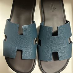 Brand New, Never Worn Hermes Izmir Sandal Bleu Canard Size 42.5 Designer Blue Slides With Branded Insole, Blue Leather Slides For Vacation, Designer Blue Slides For Summer, Designer Blue Slip-on Sandals, Luxury Blue Slides For Summer, Luxury Blue Sandals With Removable Insole, Luxury Blue Summer Slides, Hermes Izmir Sandal, Hermes Izmir