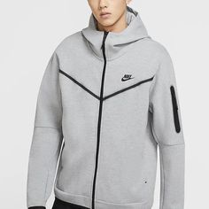 Are you looking for a comfortable and versatile Nike Tech Fleece gray hoodie? Look no further! KICKS CREW has exactly what you need - the best Nike Tech Fleece Men's Gray Hoodie. The unique mix of materials creates an incredibly soft texture that delivers lightweight warmth in any look. It is engineered with mesh panels to regulate your body temperature while its ribbed cuffs, stands collar and scuba-style hood provide extra coverage on colder days. Whether worn casually or open up as a layering