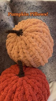 there is a stuffed pumpkin sitting on top of the pillow that says, pumpkin pillows