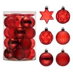 red glass christmas ornaments in a clear container with star ornament and other decorations