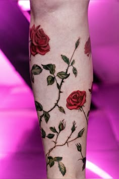 a woman's leg with roses painted on it