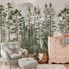 a living room with a chair, dresser and wallpaper that has trees on it