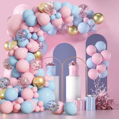 a pink and blue balloon arch is surrounded by balloons, gift boxes, and presents