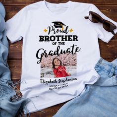 Celebrate your brother's or sister's graduation with this modern t-shirt featuring a "Proud BROTHER of the Graduate" caption in black contemporary fonts decorated with a grad cap with a golden tassel. Easily customize this t-shirt with a picture of the graduate, the graduation year, and the school's name by editing the template fields.
This t-shirt is part of our "Graduation Family Matching T-Shirts" with many coordinating items for any family member.
For further requests, personalizations, colo Graduation Tshirt Ideas For Family, College Graduation Shirts For Family, Family College Graduation Shirts, Graduation Shirt Ideas For Family, Graduation Shirts For Family With Photo, Graduate Shirts For Family, Graduation Shirts For Family, Graduate Photo, Stylish Plus Size Clothing